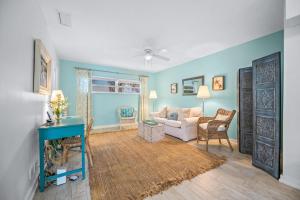 a living room with a couch and a table at Beach Side Babe in Sarasota +35 photos