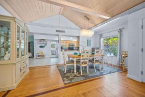 a kitchen and dining room with a table and chairs at Beach Side Babe in Sarasota