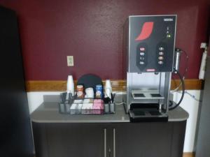 a coffee machine sitting on top of a counter at Red Roof Inn Greencastle South - Cloverdale in Cloverdale