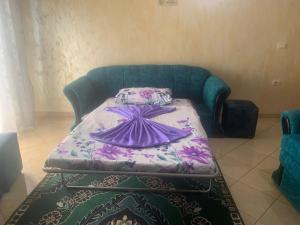 A bed or beds in a room at Guest House Fier