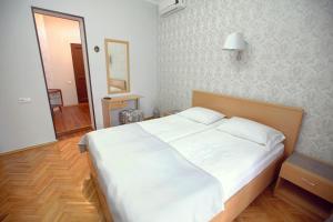 Letto o letti in una camera di Silver Hotel