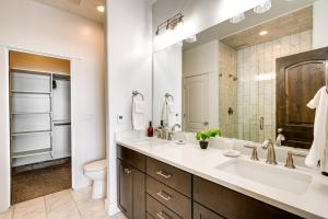 a bathroom with a sink and a toilet and a mirror at Spacious Home with Mtn View Less Than 6 Mi to Park City! in Heber City +26 photos