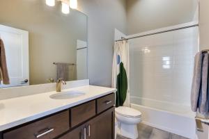 a bathroom with a sink and a toilet and a tub at Fraser Vacation Rental - Shuttle to Winter Park! in Fraser +17 photos