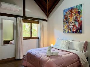 En eller flere senger på et rom på Casa Vale das Colinas 5 dorm by Achei Gramado