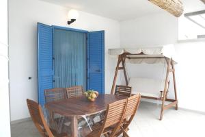 a dining room with a table and chairs and a bunk bed at Villa Giulia in Ostuni +25 photos