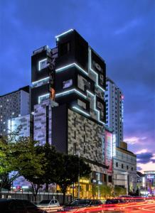 a large building with lights on the side of it at Le Stendal Hotel in Daejeon