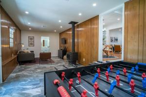 a room with a pool table and a living room at NEW! The Sage Home- Hot Tub Near Gathering Place in Tulsa