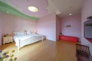 Krevet ili kreveti u jedinici u okviru objekta Tian Nian B&B