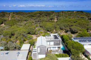 an aerial view of a house with solar panels at Sand Dunes in Point Lonsdale