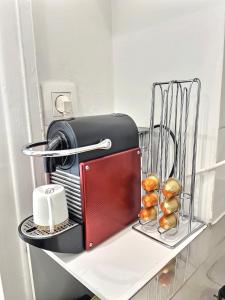 a toaster sitting on top of a shelf at Cosy Studio Père-lachaise-Pelleport in Paris