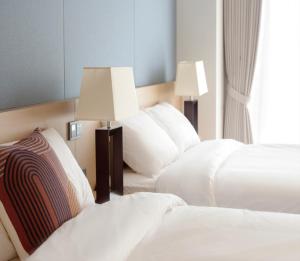 Ein Bett oder Betten in einem Zimmer der Unterkunft C-One Resort Jaeundo