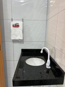 a bathroom with a sink with a faucet at POUSADA E AGENCIA CLEDIO TURISMO in Barreirinhas