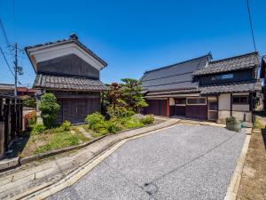 an empty street in front of a house at Chikubu Yuuan in Nagahama
