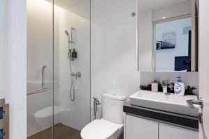 a bathroom with a shower and a toilet and a sink at EST KL Sentral Bangsar Kuala Lumpur in Kuala Lumpur