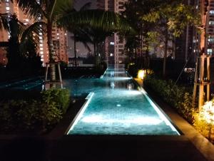 a swimming pool in a city at night at The Pano Jalan Ipoh Sentul by Kenangan Homes in Kuala Lumpur