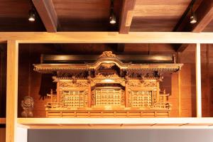 a wooden model of a building on a shelf at Classic ＆ modern SELF-STYLED HOTEL 番場おおそね in Chichibu