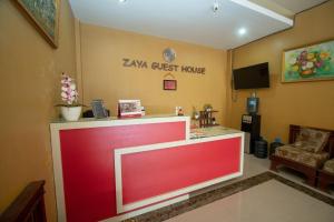 TV a/nebo společenská místnost v ubytování RedDoorz Syariah @ Jalan Gajah Mada Meulaboh