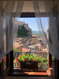 a window with a view of a city at Il Borgo in Subiaco