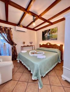 a bedroom with two beds in a room at Il Borgo in Subiaco