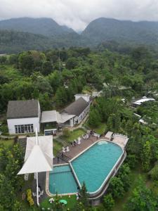 an aerial view of a resort with a swimming pool at Leuweung Geledegan Ecoldge 