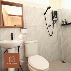a bathroom with a shower and a toilet and a sink at 23 PAI HOUSE boutique hotel in Pai