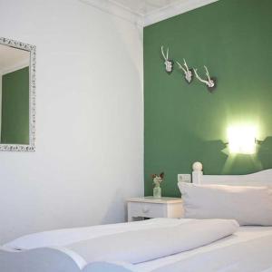 Postel nebo postele na pokoji v ubytování Hotel Egger-Stüberl