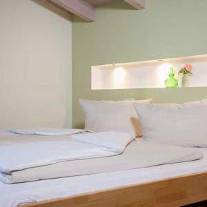 Postel nebo postele na pokoji v ubytování Hotel Egger-Stüberl