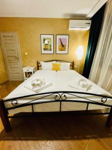 מיטה או מיטות בחדר ב-PANORAMA-М