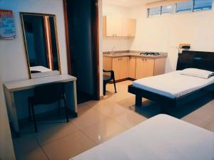 Voodi või voodid majutusasutuse HOTEL DON QUIJOTE toas