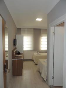 A bed or beds in a room at Sogutpark Hotel