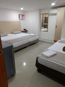Voodi või voodid majutusasutuse HOTEL DON QUIJOTE toas