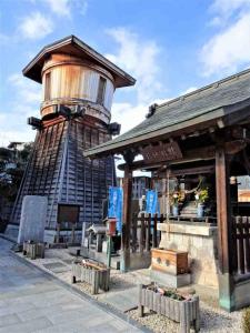 a building with a water tower on top of it at HOTEL TWO HEART - Adult Only in Fukushima