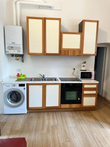 Kuchyň nebo kuchyňský kout v ubytování Conte Durini Apartments & Rooms