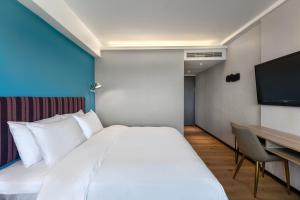 TV i/ili multimedijalni sistem u objektu River Inn Kenting