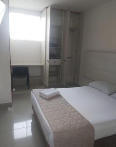 Voodi või voodid majutusasutuse HOTEL DON QUIJOTE toas