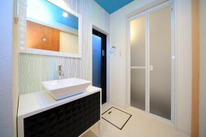 a bathroom with a sink and a shower at 柏・二条1（Haku Nijo1） in Kyoto