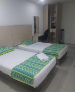 Voodi või voodid majutusasutuse HOTEL DON QUIJOTE toas