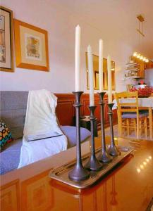 a group of candles on a table in a living room at Makati Huge & Cozy Home w/Carpark in CBD; FibrWifi in Manila