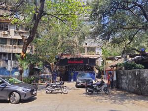 a group of motorcycles parked on a city street at OSI Apartments Carter's Road Bandra West in Mumbai