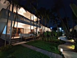 a night view of a house with a garden at 23 PAI HOUSE boutique hotel in Pai