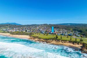 an aerial view of a beach with a resort at 1 15 Dalmeny Drive Kianga in Kianga