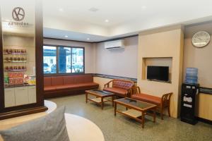 Posezení v ubytování Klaang Muang Hotel (โรงแรมกลางเมือง)