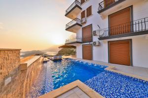 a swimming pool in the middle of a house at Sunset Butik Aparts in Kas