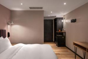 Krevet ili kreveti u jedinici u okviru objekta River Inn Kenting