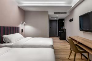 TV i/ili multimedijalni sistem u objektu River Inn Kenting