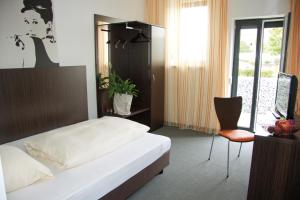 Postel nebo postele na pokoji v ubytování GS Hotel Mindelheim
