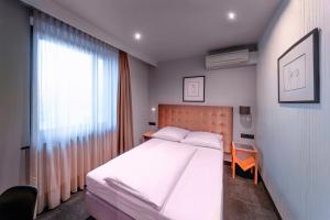 Cama ou camas em um quarto em Hotel Cult Frankfurt City