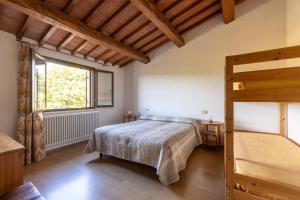 a bedroom with a bed and a window at Country House La Meria in Catabbio +25 photos