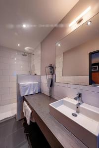 Um banheiro em Hotel Cult Frankfurt City