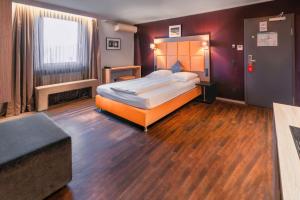 Cama ou camas em um quarto em Hotel Cult Frankfurt City
